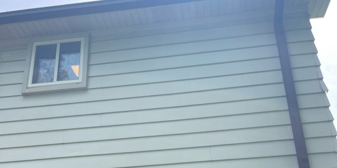 Second-story siding after power washing